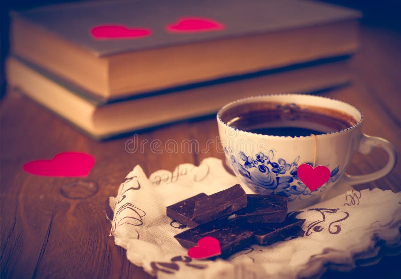 Coffee and chocolate, in the background of the heart.