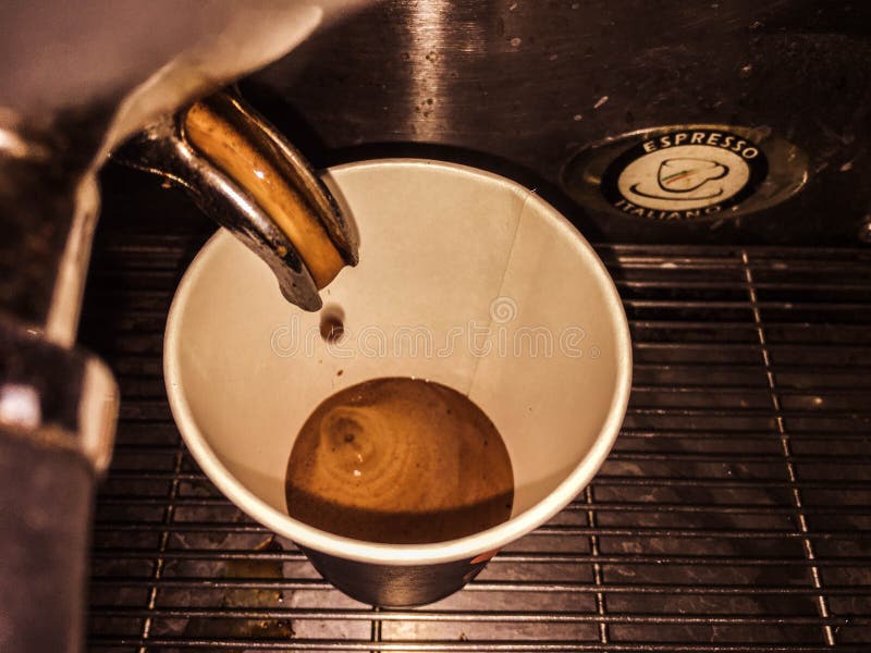 Coffee chocolate extraction into a paper cup stock photography Coffee chocolate extraction into a paper cup stock photography