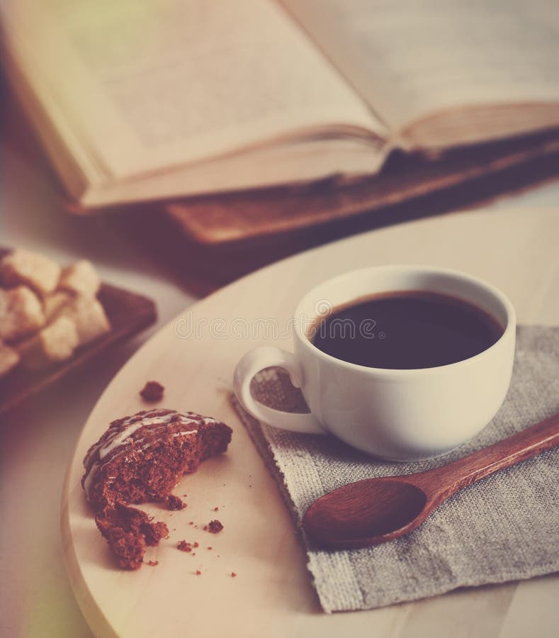 Coffee, cookie and book stock images