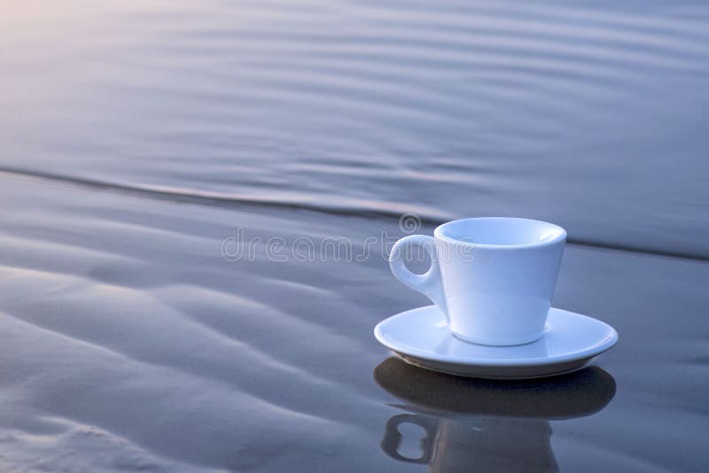 Coffee Cup on the Beach. Morning Coffee on the Beach.White Coffee Cup