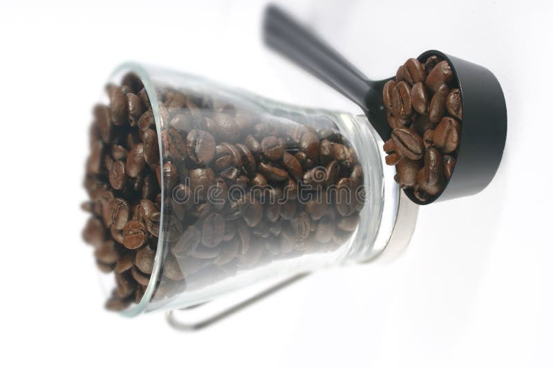 Coffee cup, beans and scoop