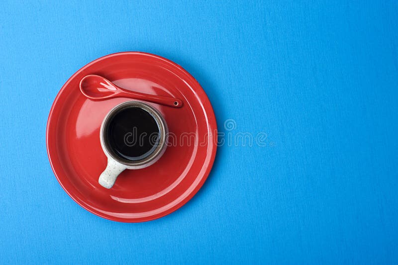 Coffee cup on blue table