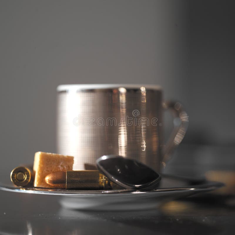 Coffee Cup and Bullets stock photo. Image of bullets 50383424