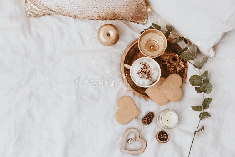 Coffee Cup, Cookies and Gold Decorations in Bed. Sweet Home, Still Life Concept. stock photography Coffee Cup, Cookies and Gold Decorations in Bed. Sweet Home, Still Life Concept. stock photography