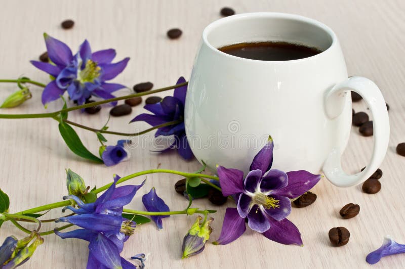 Coffee cup and flowers