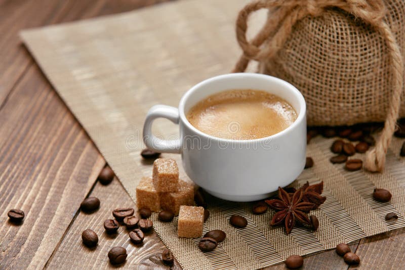 https://thumbs.dreamstime.com/b/coffee-cup-hot-beverage-close-up-mug-hot-drink-coffee-foam-near-brown-sugar-cubes-spice-coffee-beans-wooden-111723728.jpg