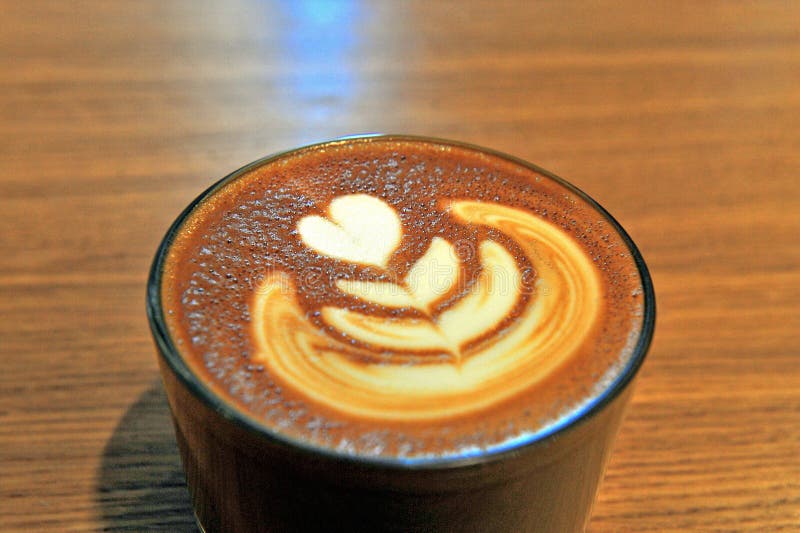 Coffee cup with latte art stock photo. Image of paint 64085594