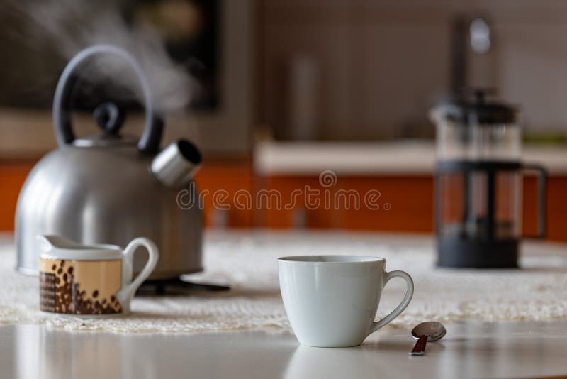 White Ceramic Electric Kettle Stand Kitchen Table Stock Photo by  ©elvirkindom@yandex.ru 199161210