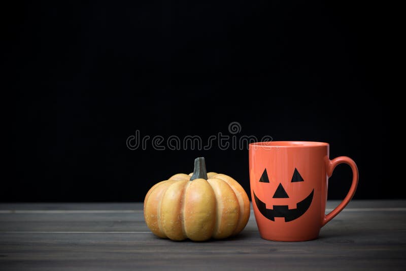 Coffee cup and pumpkin. Halloween concept stock photo