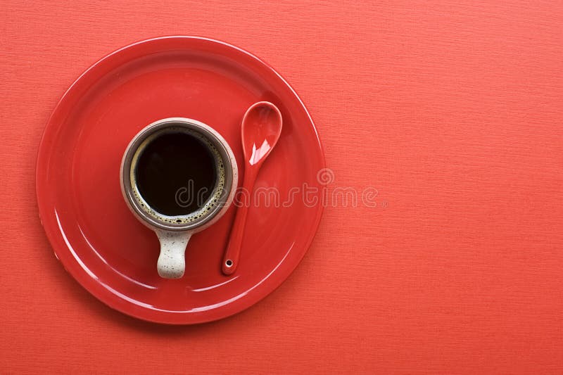 Coffee cup on red table