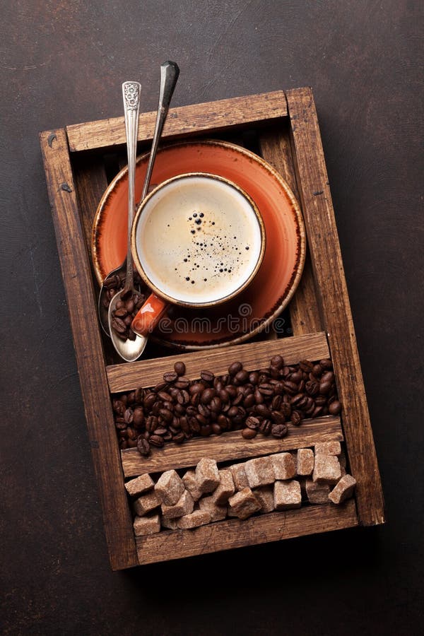 Coffee cup, roasted beans and brown sugar royalty free stock photo Coffee cup, roasted beans and brown sugar royalty free stock photo