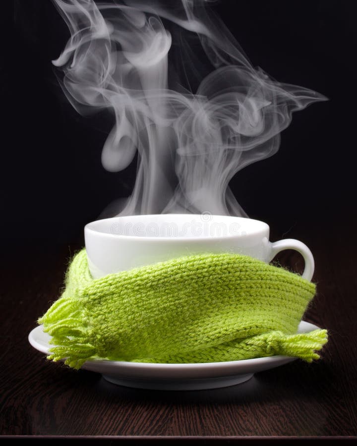 Coffee cup with smoke in green scarf royalty free stock photography Coffee cup with smoke in green scarf royalty free stock photography