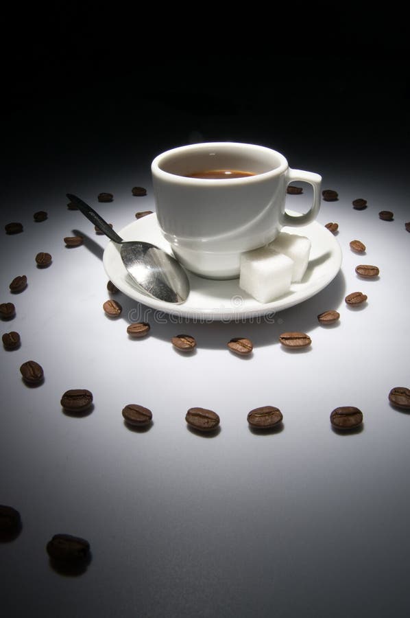 Coffee cup and spiral of grains