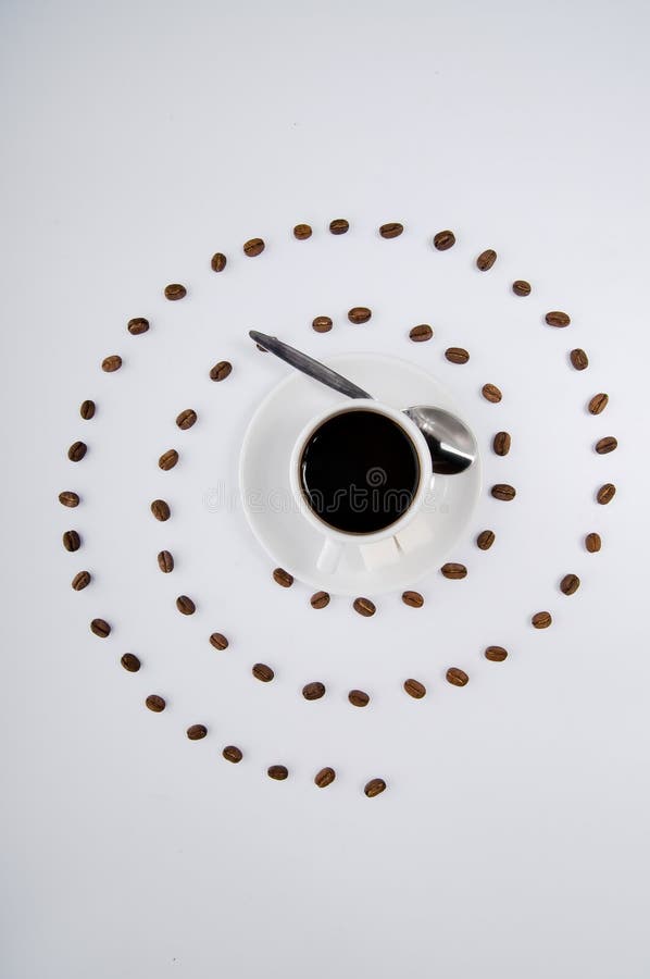 Coffee cup and spiral of grains