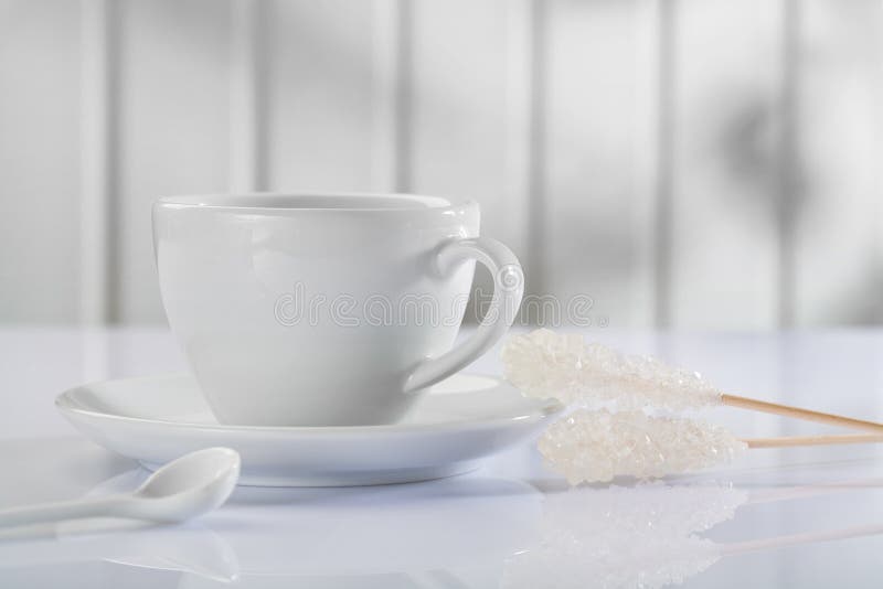 Coffee Cup with Spoon and Sugar Stickon White Table Stock Photo Image