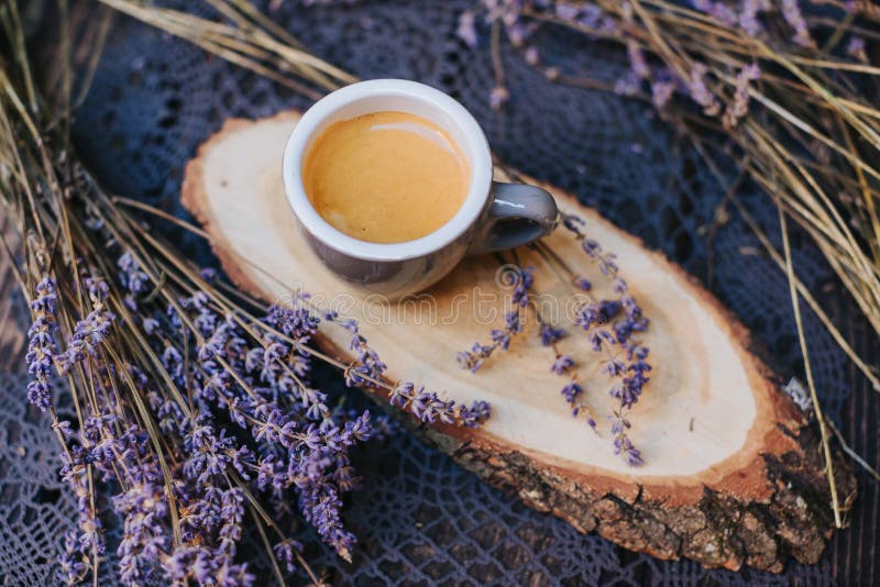 Coffee cup on table. Cup of hot latte coffee in the relaxing time. cup of coffee on wooden. Lavender. Aroma of lavender. Aroma of stock photography Coffee cup on table. Cup of hot latte coffee in the relaxing time. cup of coffee on wooden. Lavender. Aroma of lavender. Aroma of stock photography