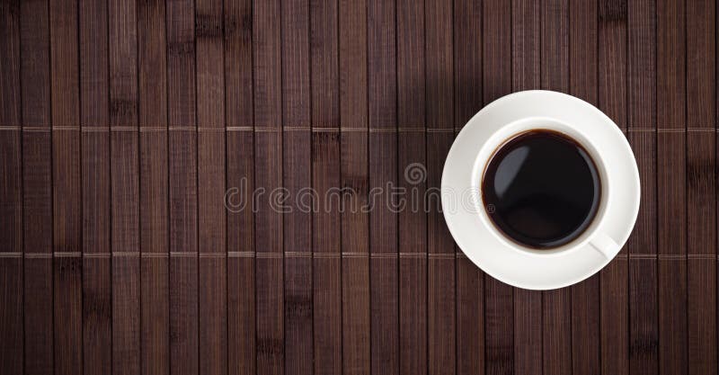 Coffee cup top view on bamboo table