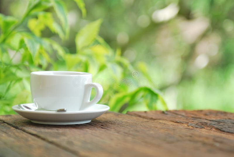 Coffee Cup On Wood Table With Green Background Stock Photo ...