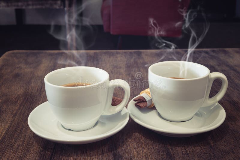 Two Coffee Cups On Wood Table In Cafe Interior Stock Photo