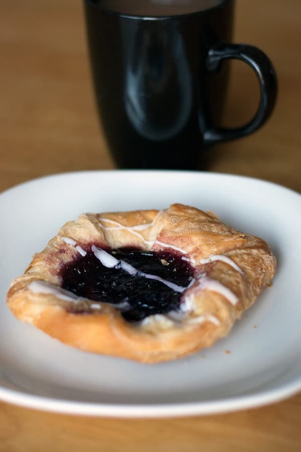 Coffee and a Danish stock photo. Image of cafe, berry 14444068