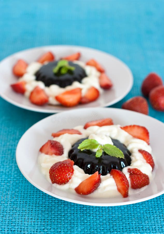 Coffee dessert with cream and strawberries