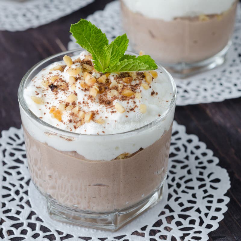 Coffee dessert with whipped cream in a glass beaker