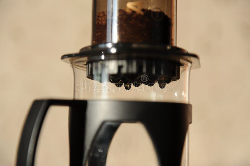 Coffee Drips through the Filter Closeup, Individual Drops Stock Photo