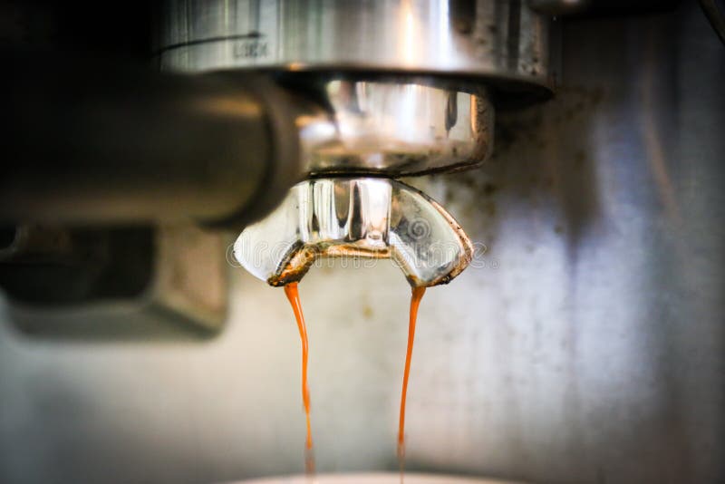 Coffee, or espresso making process - grinding and extracting coffee beans royalty free stock photo Coffee, or espresso making process - grinding and extracting coffee beans royalty free stock photo