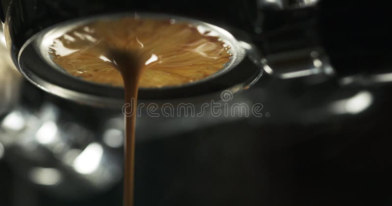 Coffee extraction with bottomless portafilter from pro machine stock footage