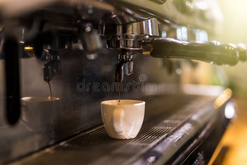 Coffee Extraction from Professional Coffee Machine. Coffee Shop Stock