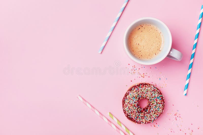 Coffee and fresh pastry of chocolate donut on pink pastel table top view. Flat lay. Cozy breakfast. stock photo Coffee and fresh pastry of chocolate donut on pink pastel table top view. Flat lay. Cozy breakfast. stock photo
