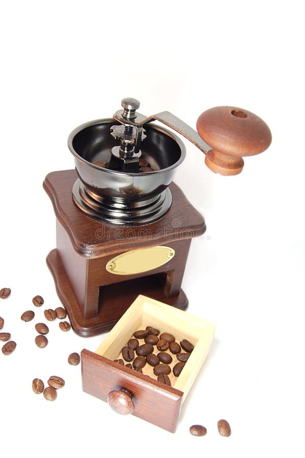 Coffee grinder and beans around