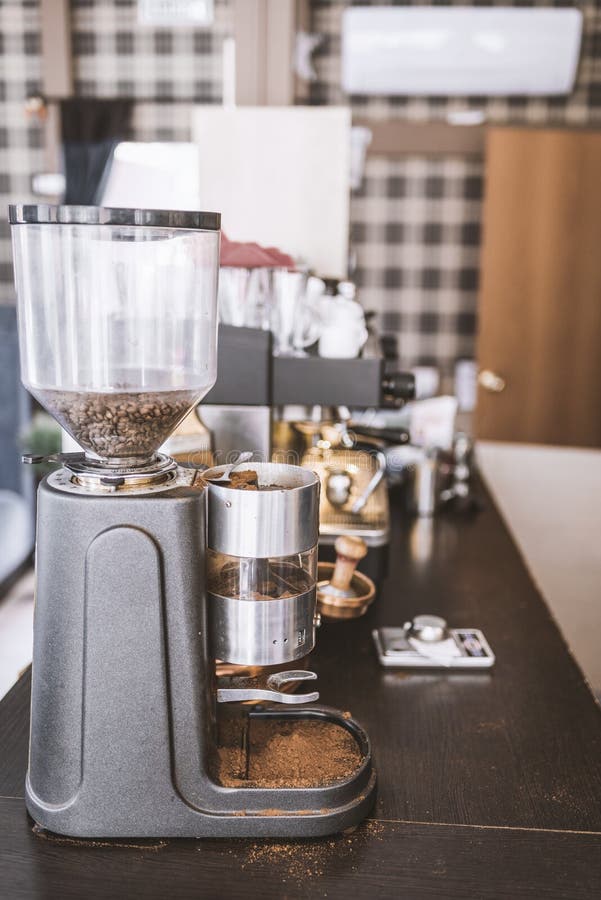 Coffee Grinder in the Cafe on the Bar Counter , Vertical Frame Stock