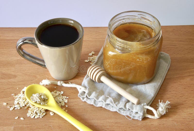 Breakfast Scene with Coffee, Natural Honey and Oat Flakes Stock Image