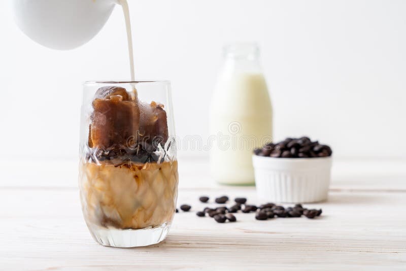 Coffee ice cubes with milk stock photo. Image of cool 132810328