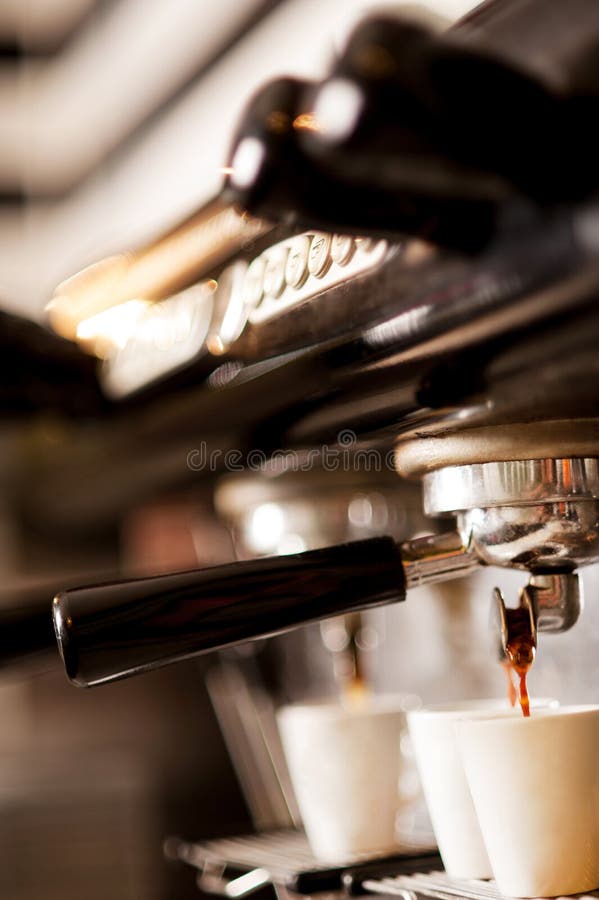 Espresso Machine Pouring Coffee in Cups at Restaurant or Pub. Barista