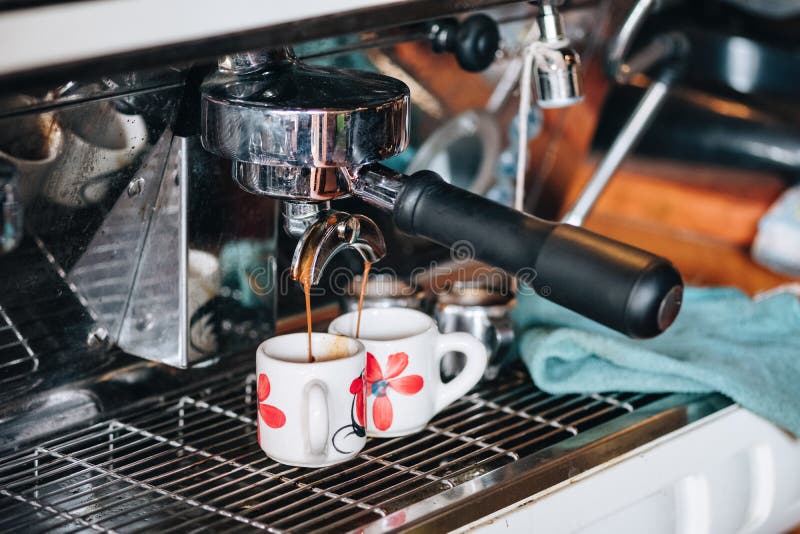 Coffee Maker making coffee flowing in cup stock photo Coffee Maker making coffee flowing in cup stock photo