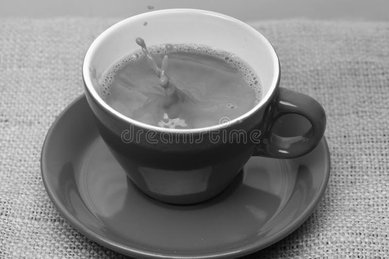 Coffee Making Concept. Fresh Brewed Coffee Poured into Cup with