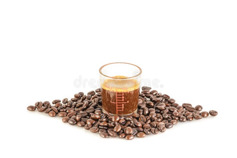 Coffee in Measuring Cup and Coffee Beans on the White Background Stock