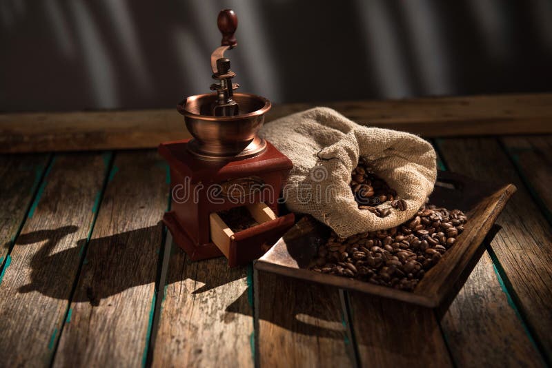 Coffee Mill on Dark Rustic Background. Wood Table Stock Photo Image