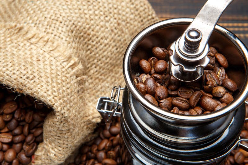 Coffee Mill and Roasted Beans on Wooden Background Stock Photo Image