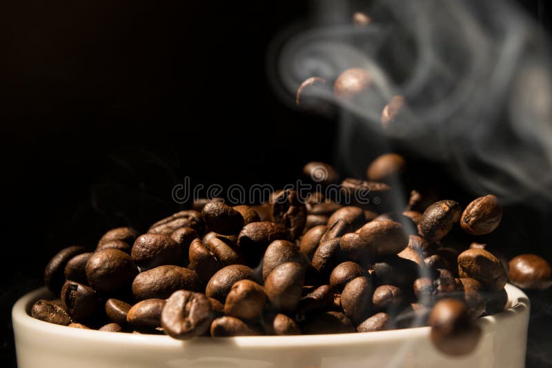Coffee Mug Full Of Coffee Beans With Smoke Stock Photo Image of full