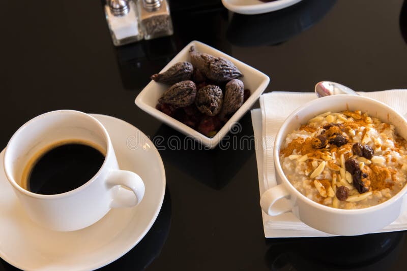 Coffee and Oatmeal with Dried Fruit Healthy Breakfast Setting Stock