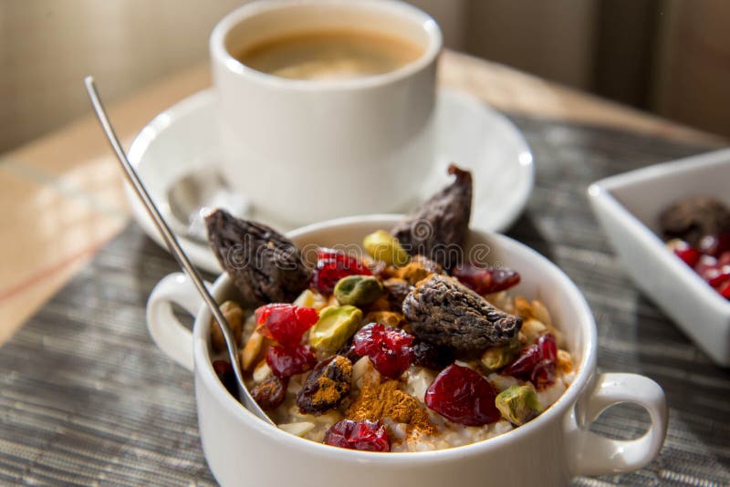 Coffee and Oatmeal with Dried Fruit Healthy Breakfast Setting Stock
