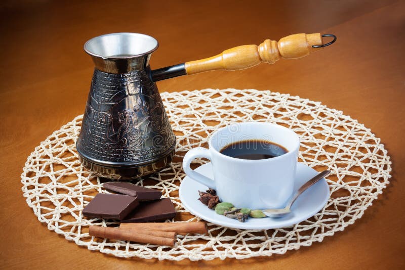Coffee Pot, Cup of Coffee with Spices and Pieces of Chocolate Stock