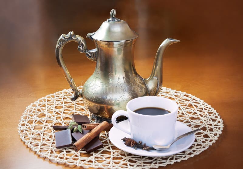 Coffee Pot, Cup of Coffee , Spices and Pieces of Chocolate Stock Photo