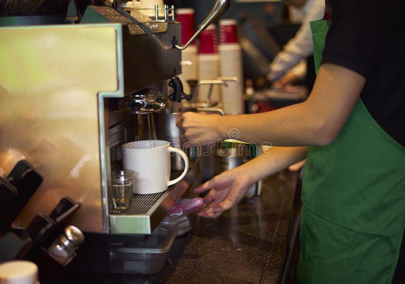 Coffee shop staff preparing coffee stock photography Coffee shop staff preparing coffee stock photography