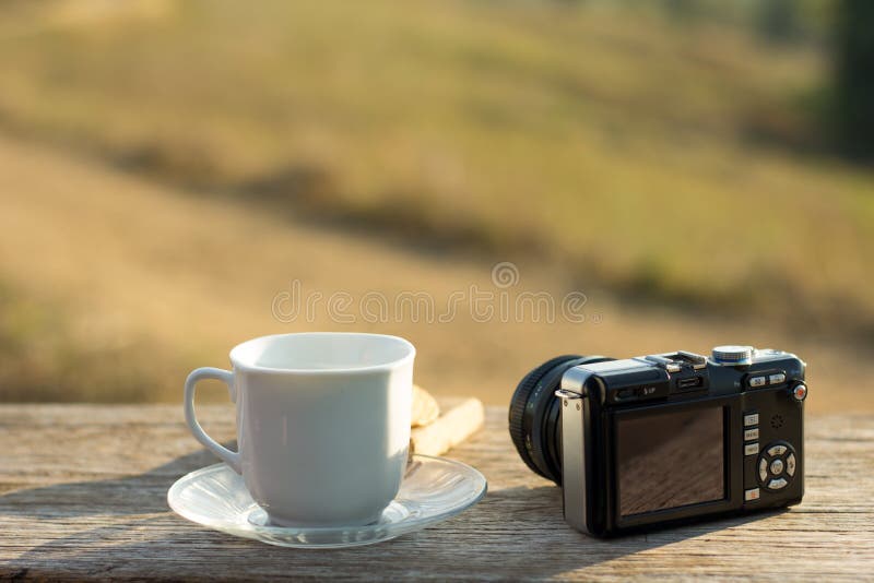 Coffee with snacks meadows as a backdrop, Place the camera with stock images Coffee with snacks meadows as a backdrop, Place the camera with stock images