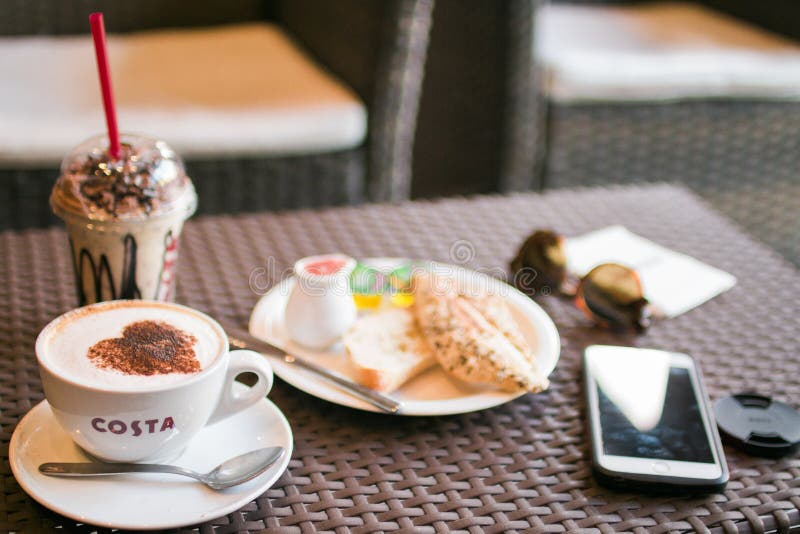 Coffee And Snacks On Table With Mobile Picture. Image 83065770