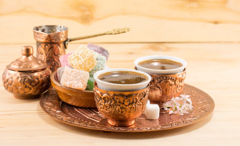 Coffee and Turkish delight in a copper cups stock images Coffee and Turkish delight in a copper cups stock images